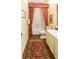 Neutral bathroom featuring a bathtub, toilet, vanity and decorative accents at 1187 Ward Creek Sw Dr, Marietta, GA 30064
