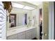 Bright bathroom featuring a vanity with storage, framed art and a large mirror at 1187 Ward Creek Sw Dr, Marietta, GA 30064