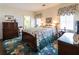 Well-appointed bedroom with floral accents, a large bed and ample closet space at 1187 Ward Creek Sw Dr, Marietta, GA 30064