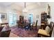 Formal dining room with a chandelier, large windows, and elegant furnishings at 1187 Ward Creek Sw Dr, Marietta, GA 30064