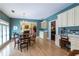 Elegant dining room with hardwood floors, chandelier, and views of the fireplace in the living room at 1187 Ward Creek Sw Dr, Marietta, GA 30064