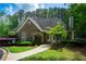 Charming home featuring stone accents, well-manicured landscaping, and a welcoming entrance at 1187 Ward Creek Sw Dr, Marietta, GA 30064