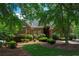 Charming brick home with manicured landscaping and mature trees offers great curb appeal at 1187 Ward Creek Sw Dr, Marietta, GA 30064