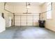 Attached garage with ample storage and a functional overhead door at 1187 Ward Creek Sw Dr, Marietta, GA 30064