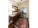 Hallway with hardwood floors, dark wood furniture, mirror, and an arched doorway at 1187 Ward Creek Sw Dr, Marietta, GA 30064