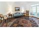 Bright living room with a decorative rug, elegant seating, and French doors at 1187 Ward Creek Sw Dr, Marietta, GA 30064