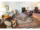 Spacious living room with stylish furnishings, a patterned rug, and French doors at 1187 Ward Creek Sw Dr, Marietta, GA 30064
