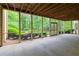 Covered and screened outdoor porch offering views of the lush, landscaped backyard at 1187 Ward Creek Sw Dr, Marietta, GA 30064
