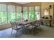Bright sunroom with a dining table, chairs, and views of the outdoors at 1187 Ward Creek Sw Dr, Marietta, GA 30064
