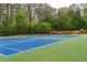 Community tennis courts surrounded by lush greenery offering recreational opportunities at 1187 Ward Creek Sw Dr, Marietta, GA 30064