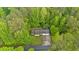 Overhead aerial view of the property surrounded by mature trees at 161 Gann Cemetery Rd, Dallas, GA 30157