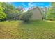 Side view of the home with large back yard and covered porch at 161 Gann Cemetery Rd, Dallas, GA 30157