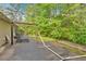 Backyard patio with pergola and outdoor seating area amidst natural surroundings at 161 Gann Cemetery Rd, Dallas, GA 30157