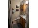 Bathroom featuring a single sink vanity and essential supplies on the shelves at 161 Gann Cemetery Rd, Dallas, GA 30157