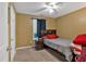 Cozy bedroom with a dark-colored bed frame, neutral walls, and ceiling fan at 161 Gann Cemetery Rd, Dallas, GA 30157