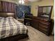 Bedroom featuring a bed and large dresser with mirror at 161 Gann Cemetery Rd, Dallas, GA 30157