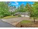 Charming ranch home featuring an attached two-car garage, long driveway, and well-manicured lawn at 161 Gann Cemetery Rd, Dallas, GA 30157