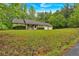 Traditional style house with a well-manicured lawn and three car garage at 161 Gann Cemetery Rd, Dallas, GA 30157