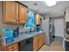 Functional kitchen featuring wood cabinets, stainless steel appliances, and ample counter space at 161 Gann Cemetery Rd, Dallas, GA 30157