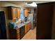 Cozy kitchen with stainless steel appliances, wooden cabinets, and ample counter space at 161 Gann Cemetery Rd, Dallas, GA 30157