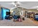 Spacious living room with a ceiling fan, neutral carpet and some personal belongings visible at 161 Gann Cemetery Rd, Dallas, GA 30157