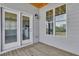 Balcony with views to the kitchen has a full window and glass doors to the interior at 1610 Habersham Villa Dr, Cumming, GA 30041