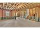 Unfinished basement with stairs ready for customization, featuring exposed beams and concrete flooring at 1610 Habersham Villa Dr, Cumming, GA 30041