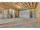 Unfinished basement ready for customization, featuring exposed beams and concrete flooring at 1610 Habersham Villa Dr, Cumming, GA 30041