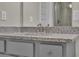 Stylish bathroom vanity with a granite countertop, undermount sink, and modern faucet at 1610 Habersham Villa Dr, Cumming, GA 30041
