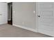 Neutral bedroom showing door frames and neutral carpet at 1610 Habersham Villa Dr, Cumming, GA 30041