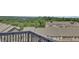 Rooftop view of the community with lush greenery and a lake in the distance at 1610 Habersham Villa Dr, Cumming, GA 30041