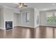 Bright living room with hardwood floors, fireplace, and ample natural light at 1610 Habersham Villa Dr, Cumming, GA 30041