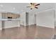 Spacious living room open to a modern kitchen with stainless steel appliances at 1610 Habersham Villa Dr, Cumming, GA 30041