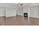 Spacious living room with hardwood flooring, a fireplace and neutral color palette at 1610 Habersham Villa Dr, Cumming, GA 30041
