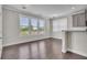 Bright and airy living room with hardwood floors and large windows at 1610 Habersham Villa Dr, Cumming, GA 30041