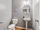 Cozy half bathroom with pedestal sink and decorative touches at 3040 Clear View Ln, Snellville, GA 30078