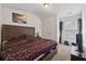 Bedroom featuring a large bed with a decorative headboard and a picturesque view at 3040 Clear View Ln, Snellville, GA 30078