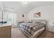Bright bedroom features a king bed with an ironing board in the corner at 3040 Clear View Ln, Snellville, GA 30078