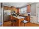 Well-equipped kitchen with stainless steel appliances, a center island, and plenty of counter space, designed for functionality at 3040 Clear View Ln, Snellville, GA 30078