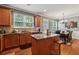 Functional kitchen flows into dining area, featuring an island, and stainless appliances, perfect for everyday living at 3040 Clear View Ln, Snellville, GA 30078