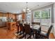 Spacious eat-in kitchen with stainless steel appliances, an island, and backyard access, great for cooking and dining at 3040 Clear View Ln, Snellville, GA 30078