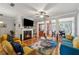 Cozy living room features a fireplace, hardwood floors, and an open floor plan, perfect for entertaining guests at 3040 Clear View Ln, Snellville, GA 30078