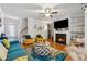 Stylish living room with hardwood floors, a fireplace, and built-in shelves, providing a cozy and organized space at 3040 Clear View Ln, Snellville, GA 30078