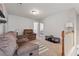 Cozy living room with plush seating, soft carpet and neutral paint at 3040 Clear View Ln, Snellville, GA 30078