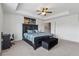 Main bedroom suite features a king bed, ceiling fan, and modern decor at 3040 Clear View Ln, Snellville, GA 30078