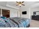 Main bedroom suite features tray ceiling, television, ceiling fan and ensuite bath at 3040 Clear View Ln, Snellville, GA 30078