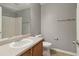 Bathroom with a single sink, cabinets, toilet and shower at 755 Magnolia Gardens Walk, Mcdonough, GA 30253