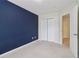 A charming bedroom with a stylish accent wall and easy access to the closet and bathroom at 755 Magnolia Gardens Walk, Mcdonough, GA 30253