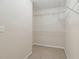 Walk-in closet with built-in shelving that offers plenty of storage space to keep your wardrobe organized at 755 Magnolia Gardens Walk, Mcdonough, GA 30253