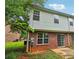 Exterior side view of a two story home with a patio at 755 Magnolia Gardens Walk, Mcdonough, GA 30253